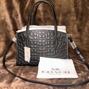 BRAND NWT: Coach Charlie Carryall 28 Inch Signature Leather.
Color: Black.